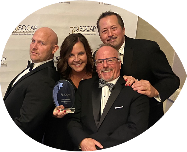 Alta Resources' Amy Bouthlilet, Patrick Nicholson, Mark Strassburg, and Steve Seidl celebrate Amy receiving the 2023 SOCAP Impact Supreme Trainer Award